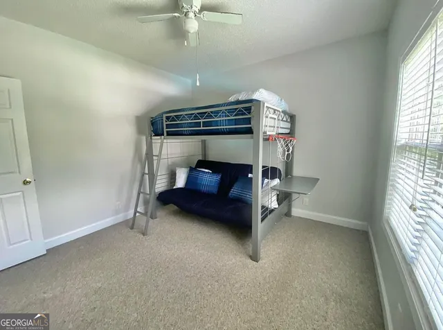 a view of livingroom with furniture and a window