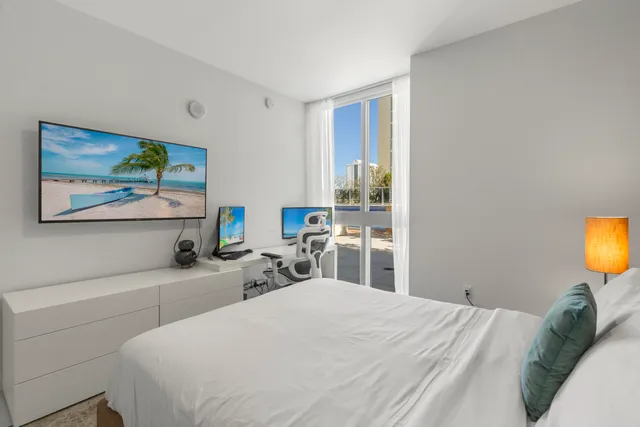 a bedroom with a bed and a chair