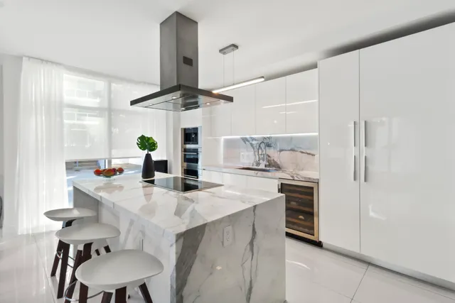 a kitchen with a sink cabinets and wooden floor