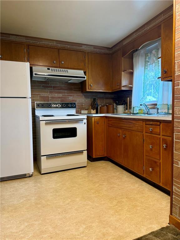151 Huntingdon Road Wyano, PA 15695 - Photo 18 of 36 a kitchen with stainless steel appliances granite countertop a stove a sink dishwasher and a refrigerator