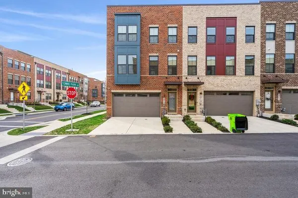 a view of multiple houses with a street