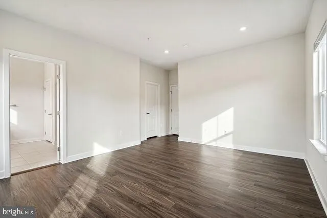 a bathroom with a glass shower door