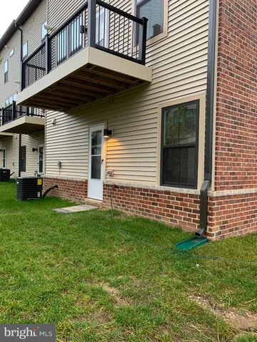 a view of multiple houses with a street