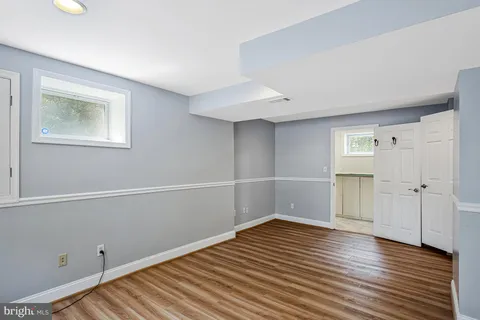a bathroom with a toilet and a bathtub