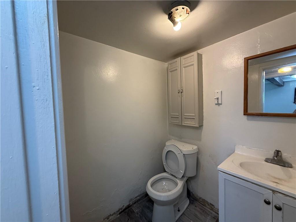 204 McCoy Road McKees Rocks, PA 15136 - Photo 19 of 25 a bathroom with a granite countertop toilet and a sink