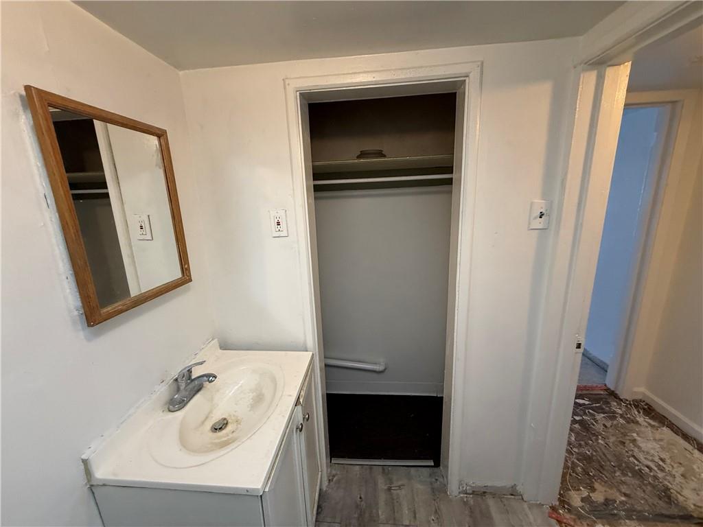 204 McCoy Road McKees Rocks, PA 15136 - Photo 20 of 25 a bathroom with a sink and mirror