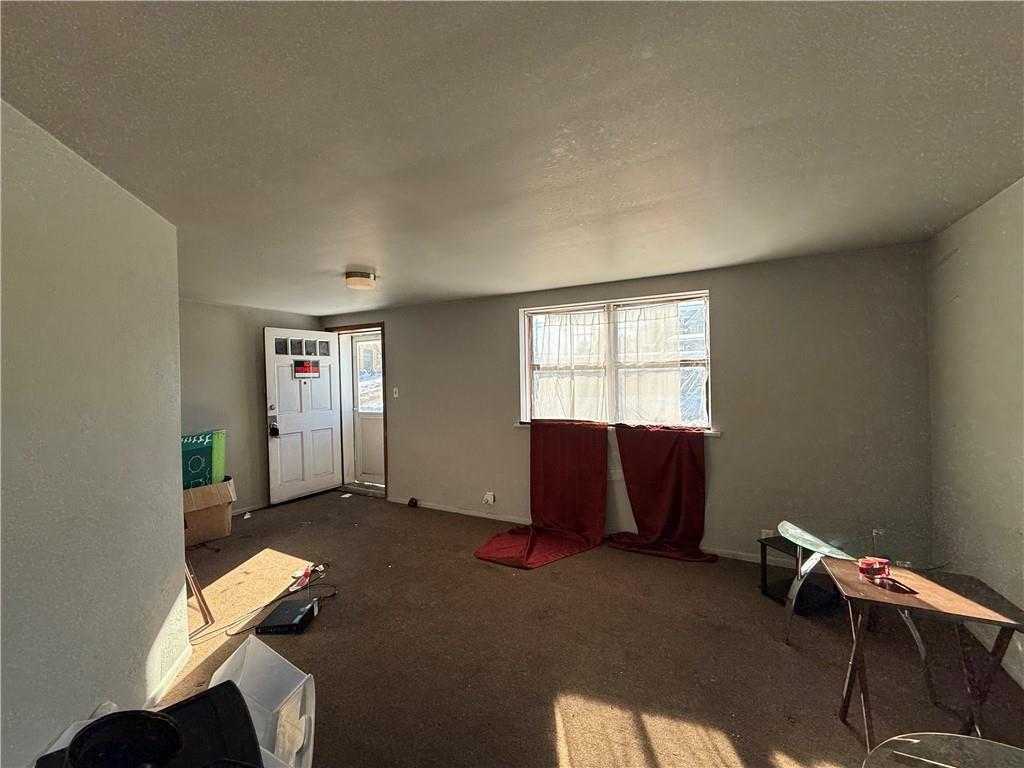 204 McCoy Road McKees Rocks, PA 15136 - Photo 4 of 25 an empty room with windows and closet