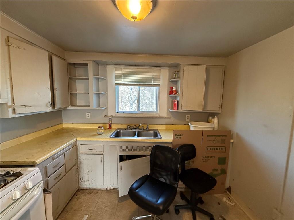 204 McCoy Road McKees Rocks, PA 15136 - Photo 8 of 25 a kitchen with a sink cabinets and window