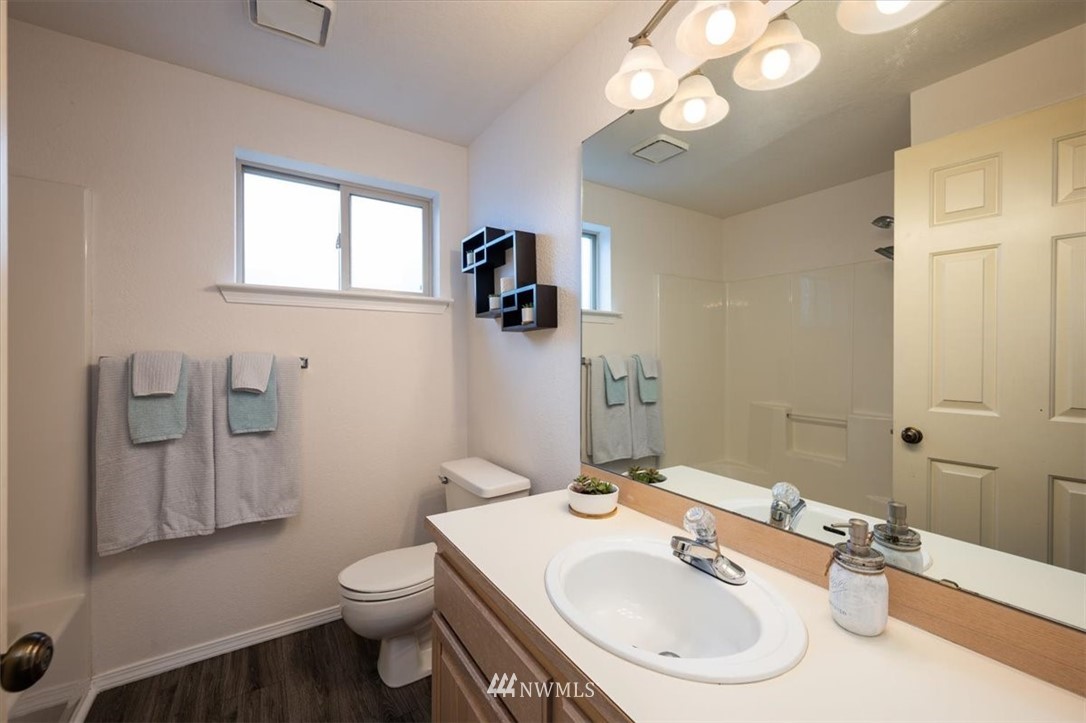 2351 Michigan Street Bellingham, WA 98229 - Photo 16 of 27 a bathroom with a sink a toilet and mirror