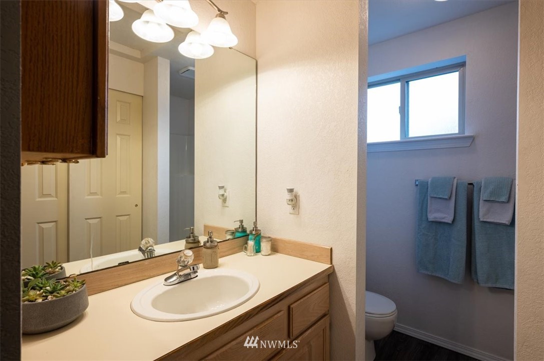2351 Michigan Street Bellingham, WA 98229 - Photo 17 of 27 a bathroom with a sink toilet and mirror