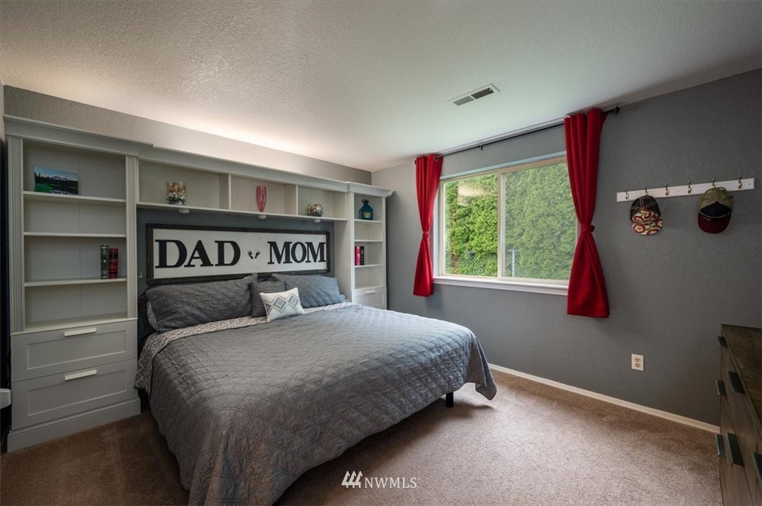 2351 Michigan Street Bellingham, WA 98229 - Photo 21 of 27 a bedroom with a large bed and a window