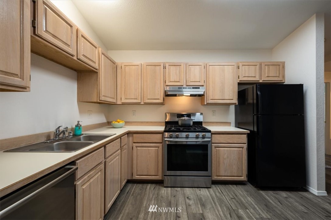 2351 Michigan Street Bellingham, WA 98229 - Photo 8 of 27 a kitchen with a sink stove and refrigerator