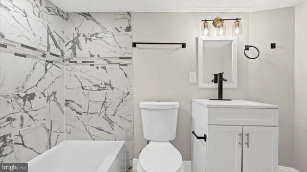 a bathroom with a toilet and a sink