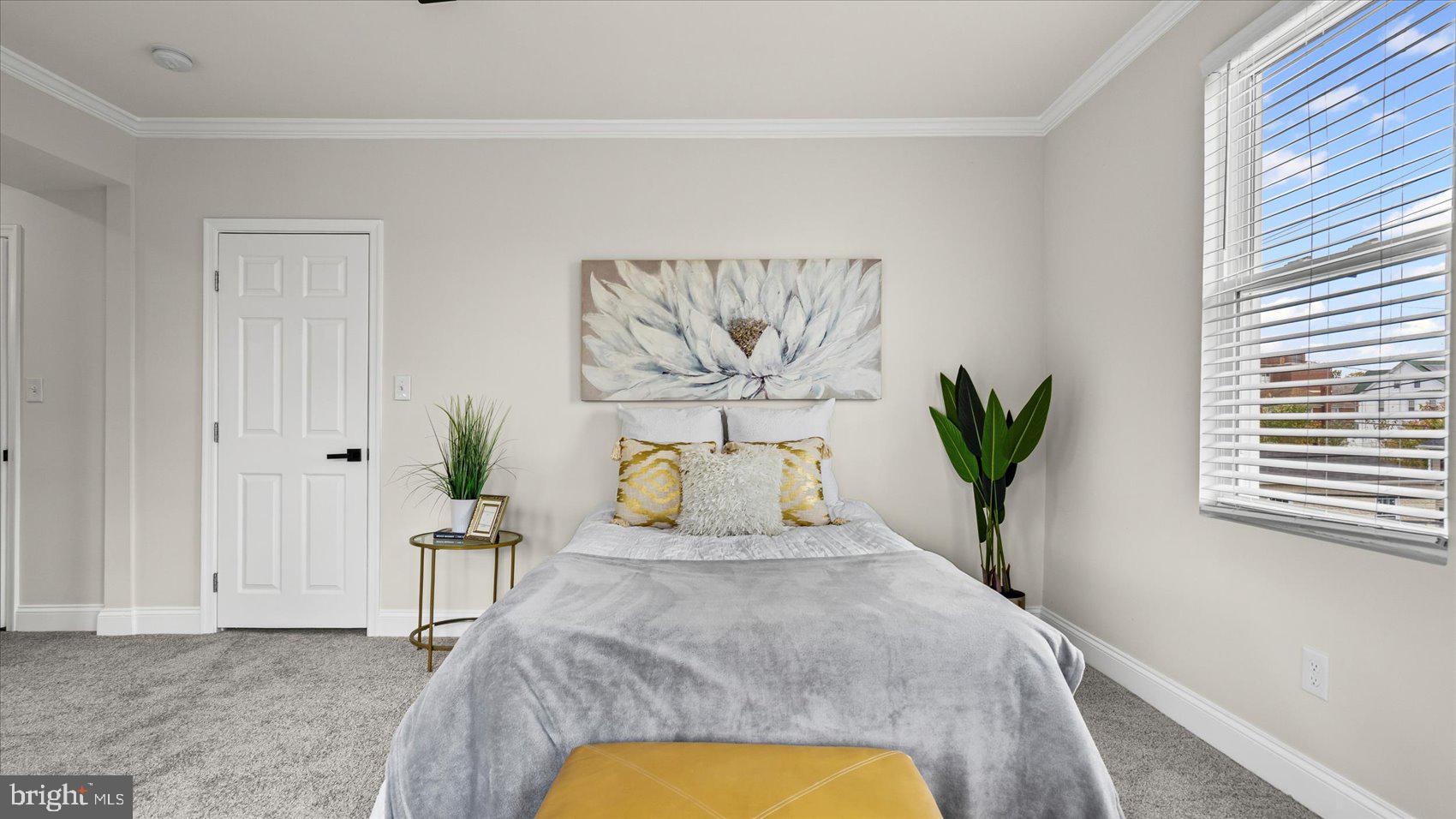 5300 Greenhill Avenue Baltimore, MD 21206 - Photo 17 of 43 a bedroom with a bed and a window