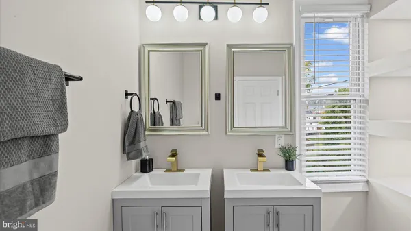 a bathroom with a sink a toilet and vanity