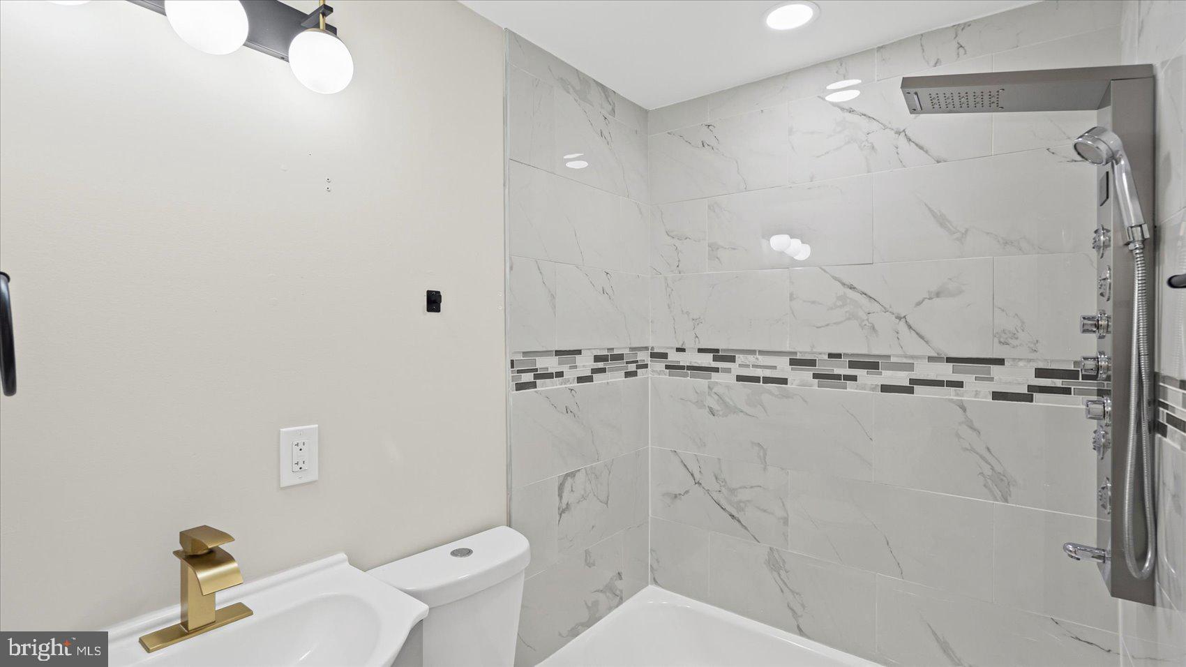 5300 Greenhill Avenue Baltimore, MD 21206 - Photo 30 of 43 a bathroom with a shower and a toilet