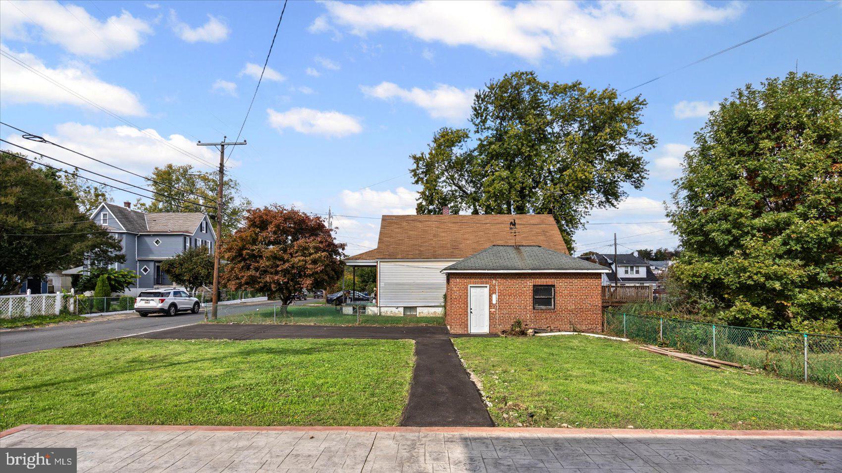 5300 Greenhill Avenue Baltimore, MD 21206 - Photo 42 of 43 a front view of a house with a yard