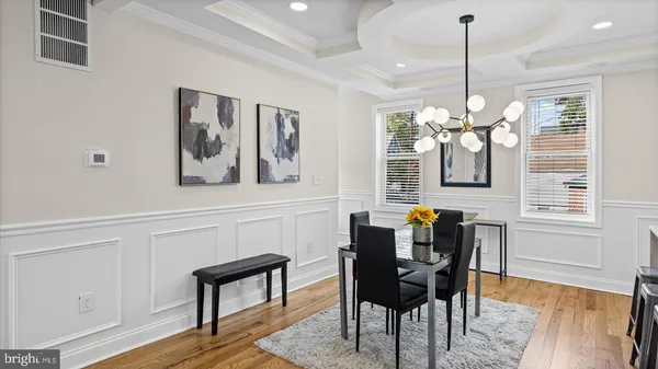 a view of a dining room with furniture window and wooden floor