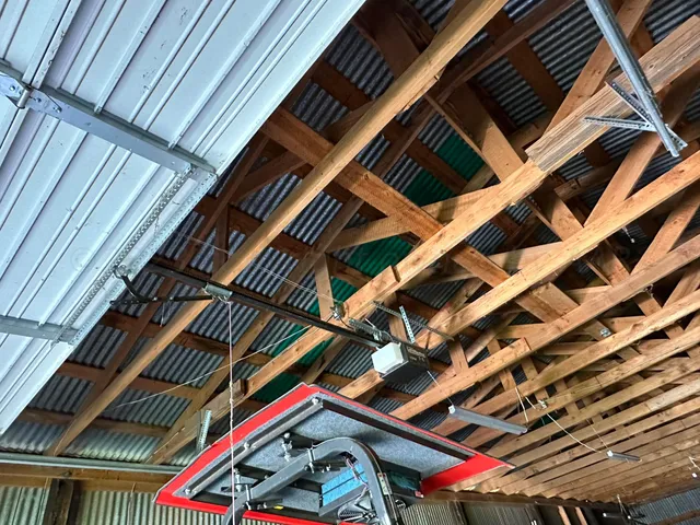 a view of a garage with a white house