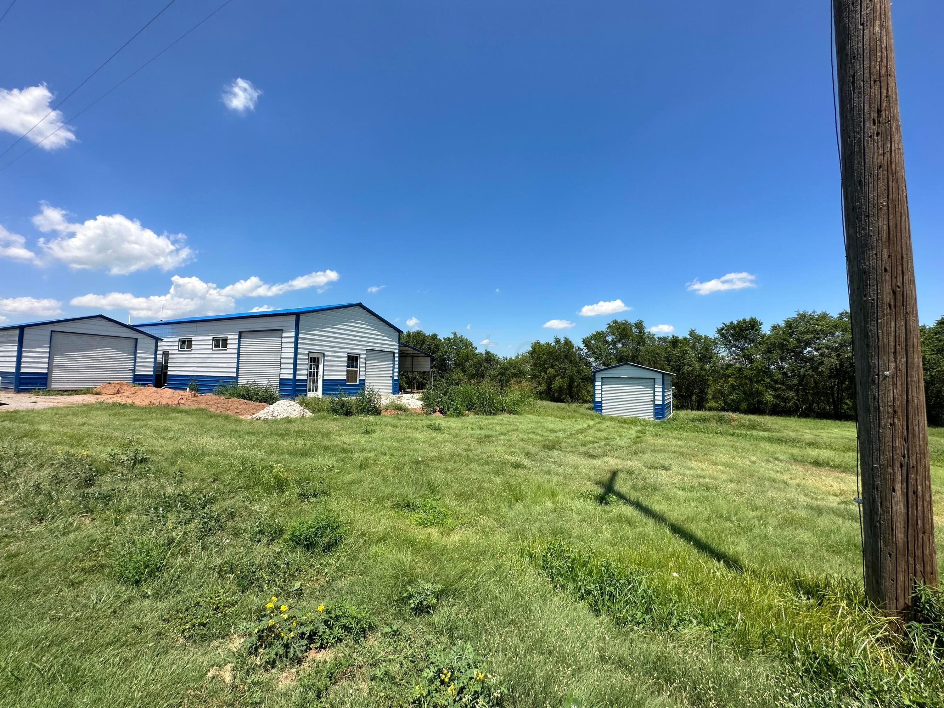 700 North Texas Street Shamrock, TX 79079 - Photo 5 of 47 a front view of a house with a yard