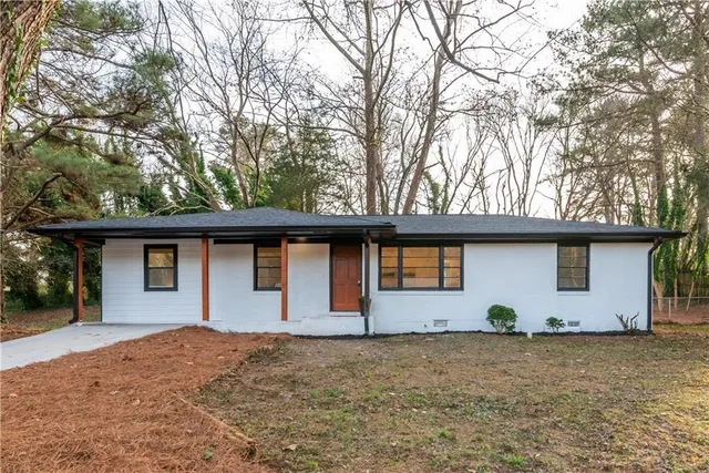 a house with trees in the background