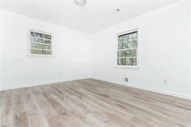 an empty room with windows