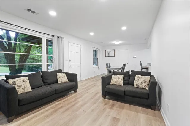 a living room with furniture and a window