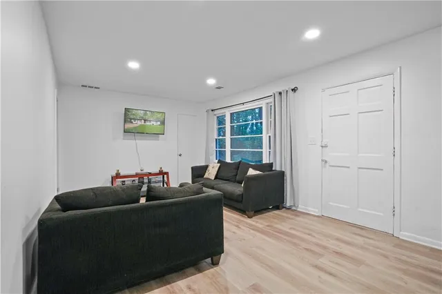 a living room with furniture and a window