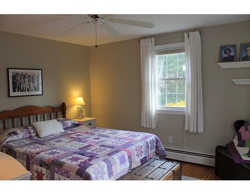 25 Mc Intosh Road Chelmsford, MA 01824 - Photo 8 of 10 a bedroom with a bed and a window
