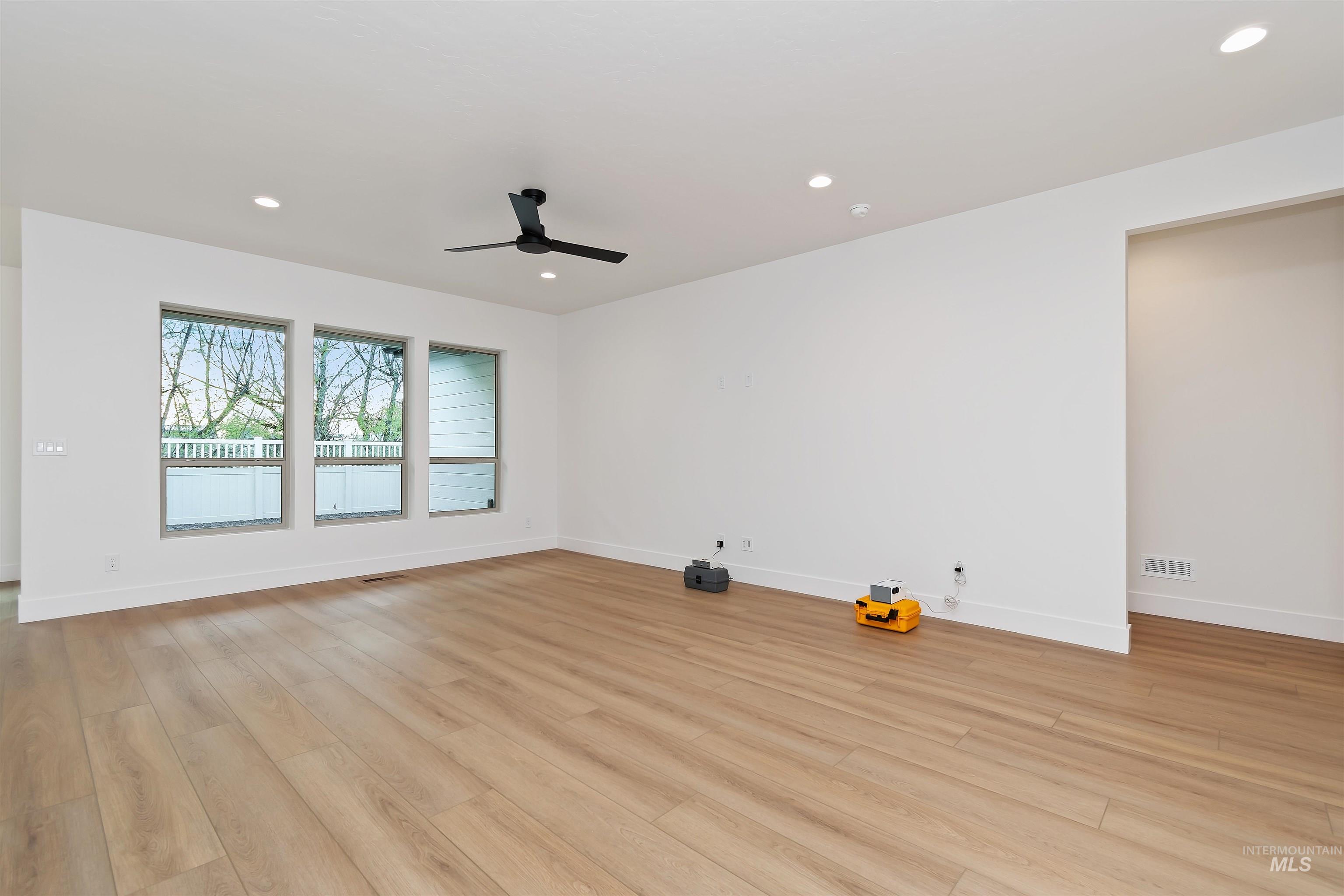 4302 Tropic Way Caldwell, ID 83607 - Photo 16 of 32 Unfurnished room featuring light wood-style flooring, recessed lighting, and a ceiling fan
