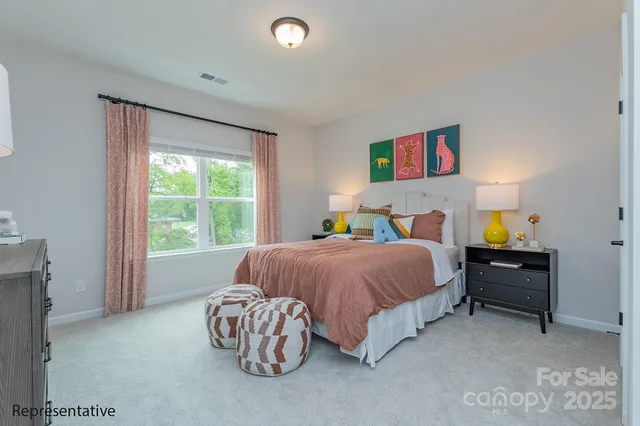 a bedroom with a bed and a couch