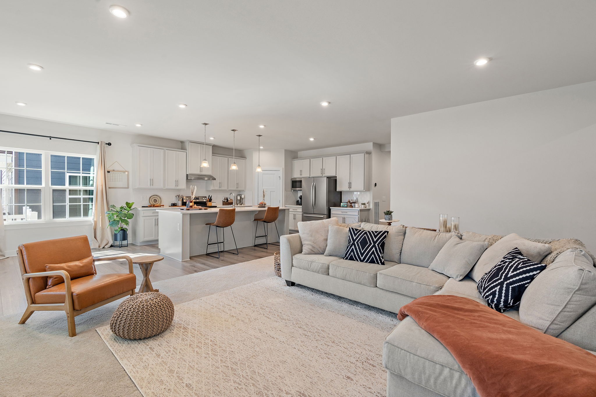 406 Ryan Avenue Gallatin, TN 37066 - Photo 14 of 45 a living room with furniture a rug and a kitchen view