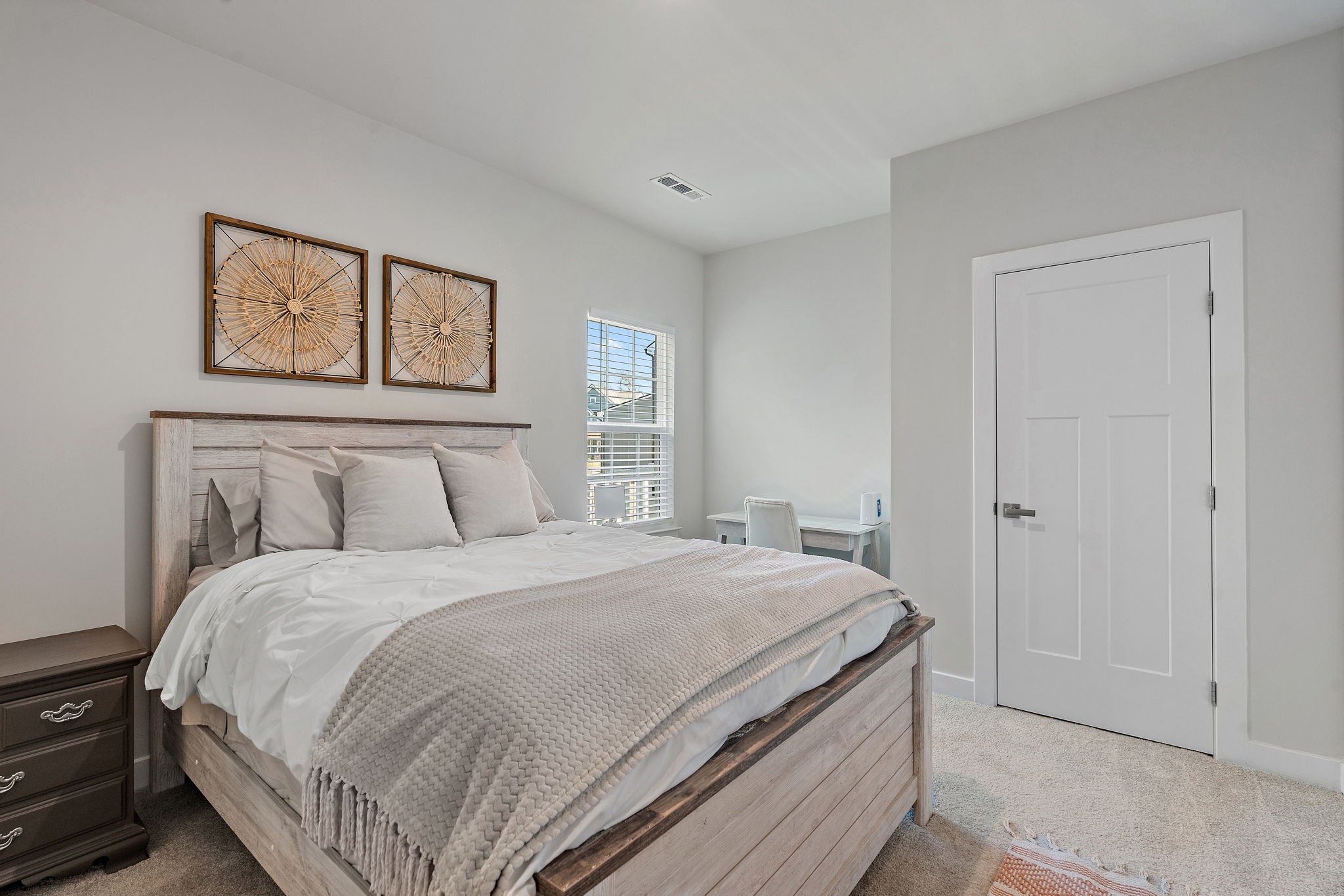 406 Ryan Avenue Gallatin, TN 37066 - Photo 20 of 45 a bedroom with a bed and a painting on the wall