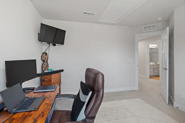 a workspace with furniture and wooden floor