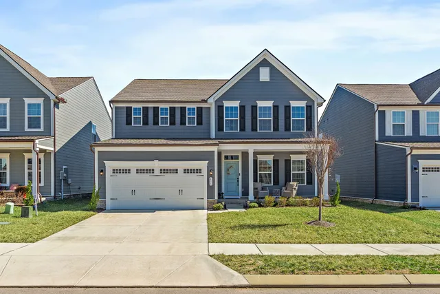 front view of a house with a yard