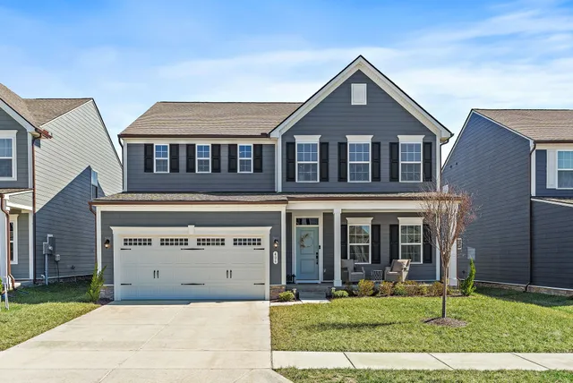 front view of a house with a yard