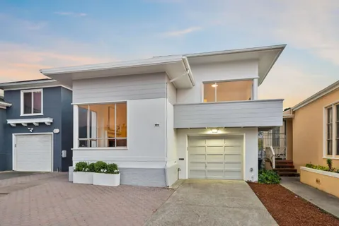 a front view of a house with a garage
