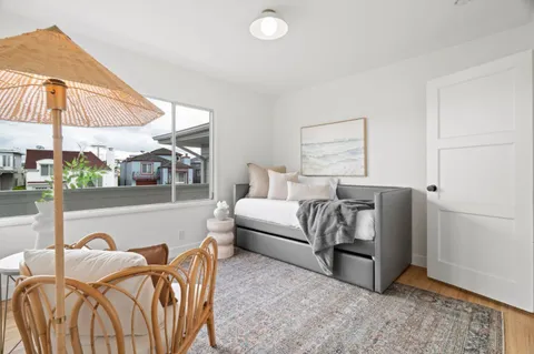 a bedroom with furniture and a window