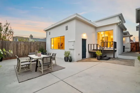 a view of a dinning table and chairs in the room