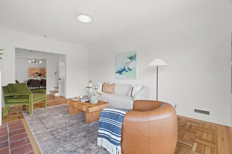 a living room with furniture and a table