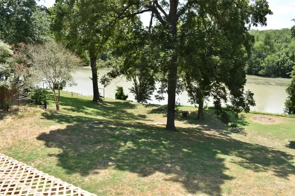 a backyard of a house with lots of green space