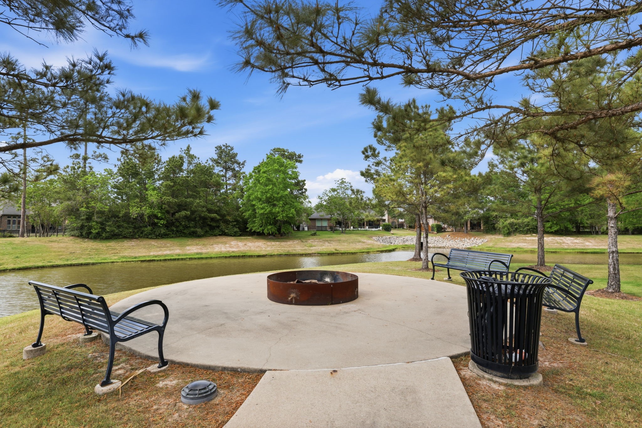 8169 Tranquil Lake Way Conroe, TX 77385 - Photo 26 of 26 a swimming pool with outdoor seating and yard