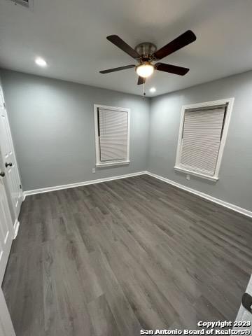 127 Parchman San Antonio, TX 78221 - Photo 5 of 6 an empty room with wooden floor fan and windows