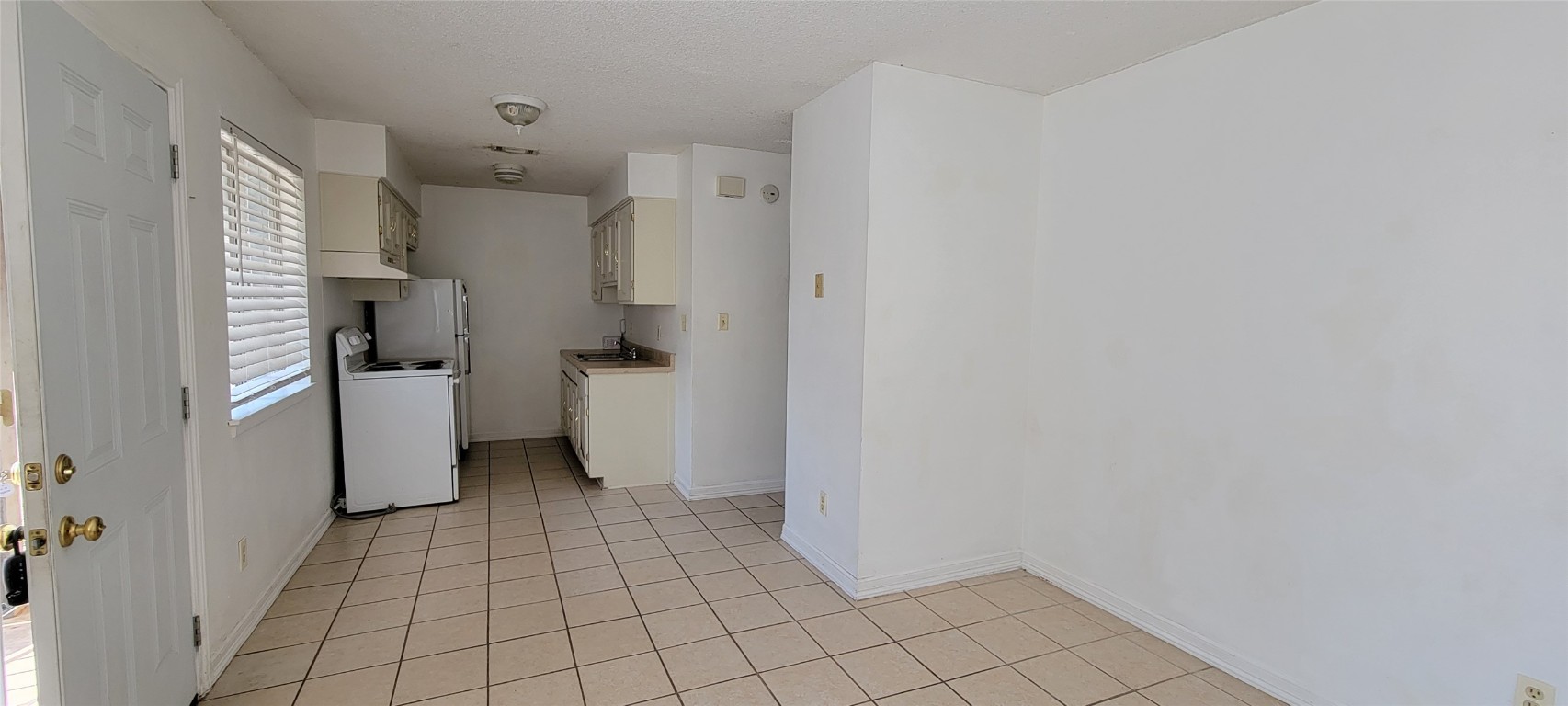 530 West Hopkins Street, Unit B San Marcos, TX 78666 - Photo 4 of 12 a view of a storage & utility room with washer and dryer