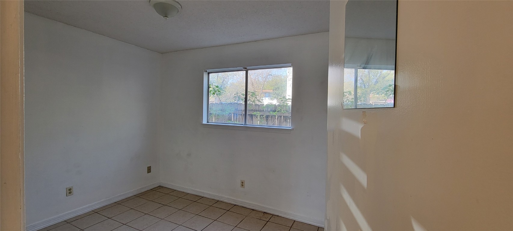 530 West Hopkins Street, Unit B San Marcos, TX 78666 - Photo 8 of 12 an empty room with a window