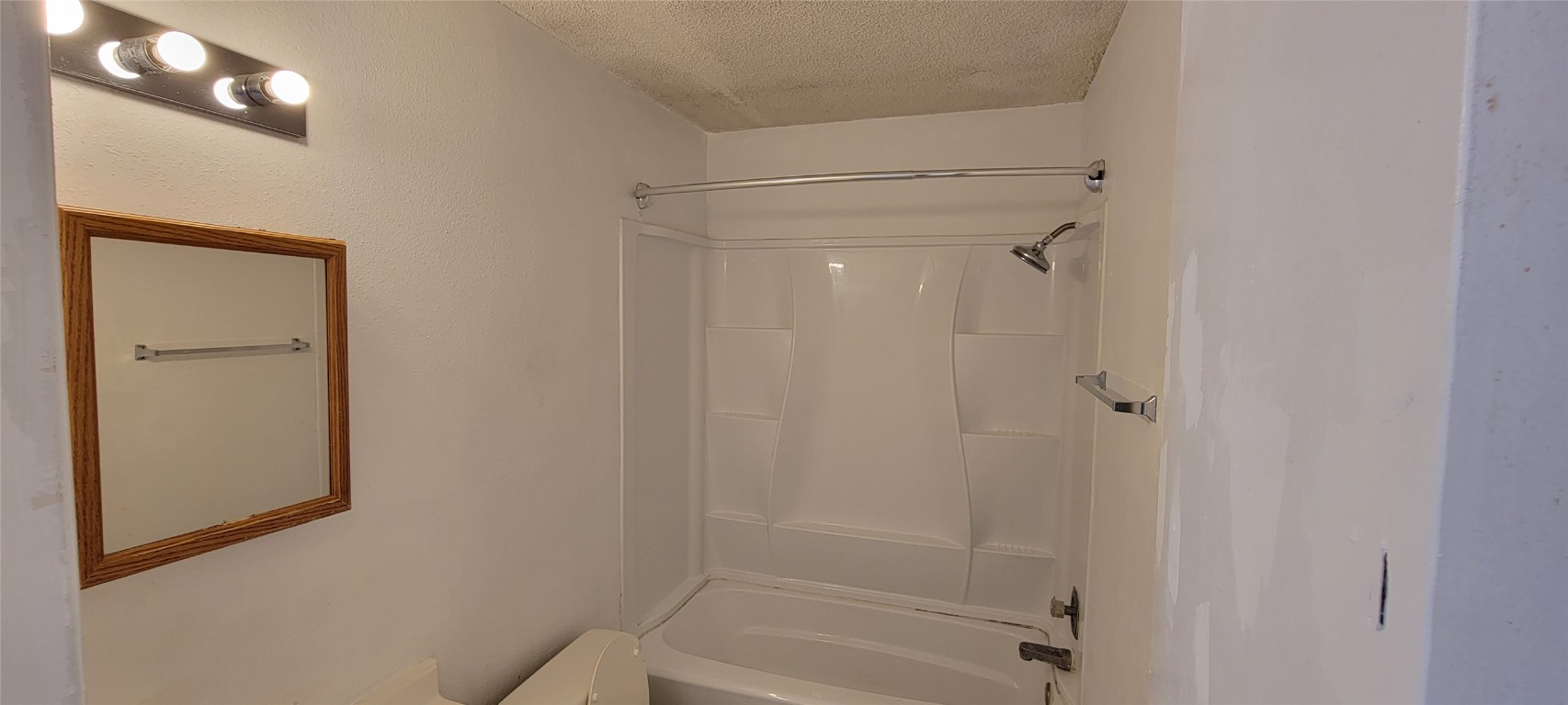 530 West Hopkins Street, Unit B San Marcos, TX 78666 - Photo 10 of 12 a bathroom with a glass shower door