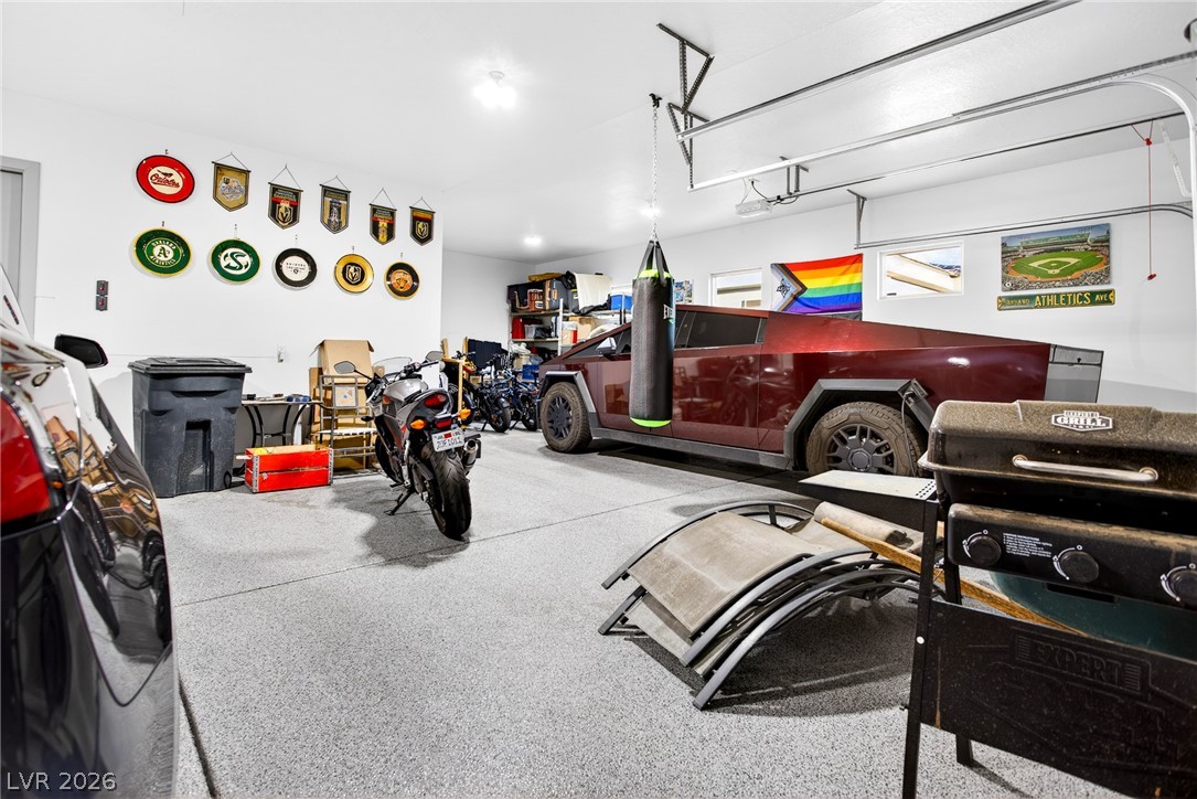 1460 Blue Ridge Trail Mesquite, NV 89027 - Photo 21 of 39 Secure, spacious garage with durable flooring for diverse vehicles and ample storage solutions.