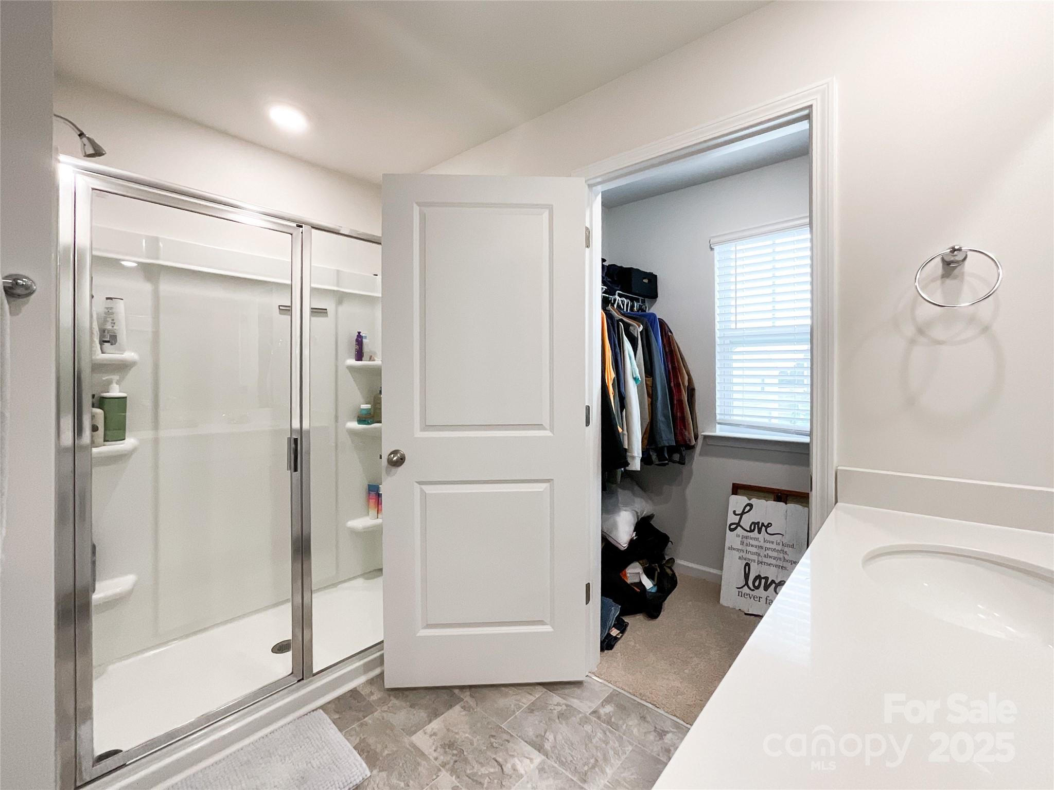 2159 Vanderlyn Street Monroe, NC 28112 - Photo 22 of 44 a view of a bathroom with a tub shower and mirror
