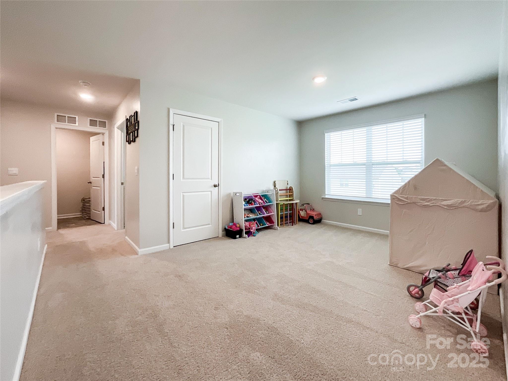 2159 Vanderlyn Street Monroe, NC 28112 - Photo 27 of 44 a living room with furniture and a window