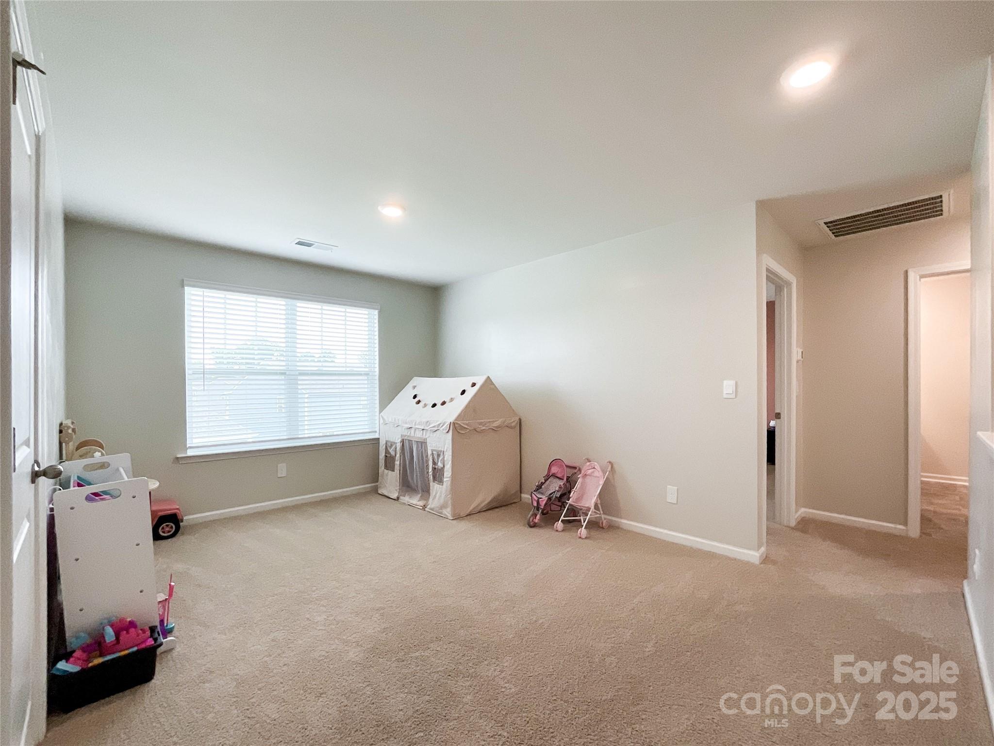 2159 Vanderlyn Street Monroe, NC 28112 - Photo 28 of 44 a bedroom with furniture and a window